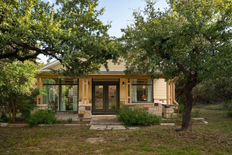 Open plan interior with Soho Home furnishings at the Noble Retreat guesthouse, Driftwood Texas